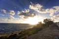 Sunset on the horizon over see and the Blue Grotto area at Malta Royalty Free Stock Photo