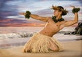 A sunset hula on the beach with a male hula dancer in traditional costume. Royalty Free Stock Photo