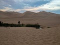 Sunset at Ica desert, small oasis surrounded by sand