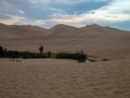 Sunset at Ica desert, small oasis surrounded by sand Royalty Free Stock Photo