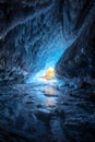 Sunset in the ice cave. Winter landscape. Lake Baikal.