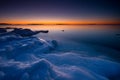 Sunset on icy beach.