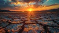 Sunset illuminates dry land Field shows signs of drought Royalty Free Stock Photo