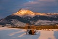 Sunset illuminates the mountain tops and the beautiful winter landscape. Royalty Free Stock Photo