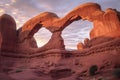 sunset illuminating sandstone archways