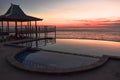 Sunset in a infinity pool.