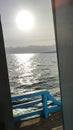Sunset from inside the ship when crossing the sea of Larantuka