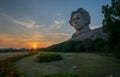 sunset on the island with a sculpture by Mao Zedong