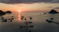 Sunset with jetty and boat in the foreground taken with drone