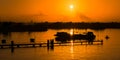 Sunset jetty silhouette orange sky nature by the sea Royalty Free Stock Photo