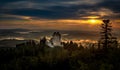 Sunset in Kasperk castle, Sumava, Czech Republic. Cold day in Sumava National park, hills and villages in the fog, misty view on Royalty Free Stock Photo