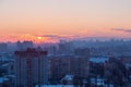 Sunset in Kiev, evening view of the panorama Kiev city. Red sun, fog and smog in the capital of Ukraine Royalty Free Stock Photo