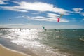 The sunset with kite surfers enjoying the sea Royalty Free Stock Photo