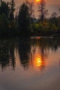 Sunset on the lake, autumn landscape, yellow foliage of trees, late evening Royalty Free Stock Photo