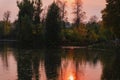 Sunset on the lake, autumn landscape, yellow foliage of trees, late evening Royalty Free Stock Photo