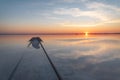 Sunset lake clouds rails reflection salt horizon Royalty Free Stock Photo