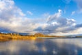 Sunset on the lake. Dramatic Spring Clouds over the still Lake. Royalty Free Stock Photo