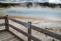Sunset Lake, a hot spring geyser in Black Sand Basin in Yellowstone National Park. Sign for the geothermal feature Royalty Free Stock Photo