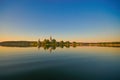 Sunset on the lake. Monastery with reflection in blue water Royalty Free Stock Photo