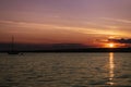 Sunset on the lake Ontario with a boat. Royalty Free Stock Photo
