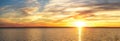 sunset lake panorama. sunset sky with clouds background. panorama of cloudscape at sunset with vivid and dreamy colors on sky Royalty Free Stock Photo