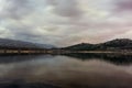 Sunset on the lake with the reflection of mountains Royalty Free Stock Photo