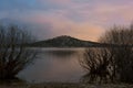 Sunset on the lake with the reflection of mountains Royalty Free Stock Photo