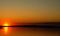 Sunset on a lake and the silouette of gull