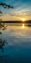 Sunset on the lake in summer. Wild nature of the taiga. Vertical format.