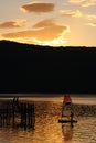 Sunset Lake Te Anau with small yacht and jetty