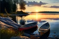 Sunset on the lake with two wooden boats on the shore.