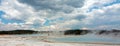 Sunset Lake under cumulus clouds in Black Sand Basin in Yellowstone National Park in Wyoming USA