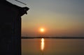 Sunset in lake water with a silhoueete wall foreground