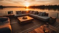 Sunset on the lake with a wooden deck and a white sofa