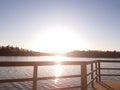 Sunset at the lake. Wooden path. Sunset at the lake. Lake and forest. Beautiful view. Walkimg by the lake. Coast.