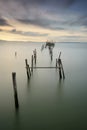 Sunset landscape of artisanal fishing boats in the old wooden pier. Carrasqueira is a tourist destination for visitors to the coas Royalty Free Stock Photo