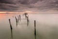 Sunset landscape of artisanal fishing boats in the old wooden pier. Royalty Free Stock Photo