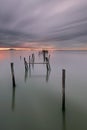 Sunset landscape of artisanal fishing boats in the old wooden pier. Royalty Free Stock Photo