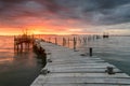 Sunset landscape of artisanal fishing boats in the old wooden pier Royalty Free Stock Photo