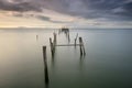 Sunset landscape of artisanal fishing boats in the old wooden pier Royalty Free Stock Photo