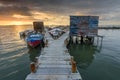 Sunset landscape of artisanal fishing boats in the old wooden pier. Carrasqueira is a tourist destination for visitors to the coas Royalty Free Stock Photo