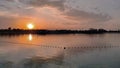 Sunset landscape on the beach with restrictive swimmer buoys Royalty Free Stock Photo