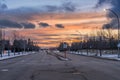 Sunset landscape in city of Edmonton with light snow cover and red and yellow traffic lights Royalty Free Stock Photo
