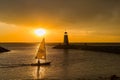 Sunset landscape with man sailing a boat around Lake Hefner Royalty Free Stock Photo