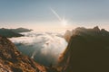 Sunset landscape mountains over fjord and clouds