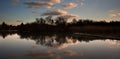 Sunset landscape over jetty on lake Royalty Free Stock Photo