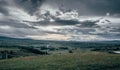 Sunset landscape with rain clouds over the Mexican countryside and a town called Almoloya de JuarÃÂ©z