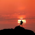 Sunset landscape with silhouette of a standing man. Travel background Royalty Free Stock Photo