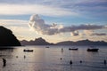 Sunset landscape on tropical island. Sea view with distant mountain and cloud. Beautiful beach Los Cabanos in EL Nido Royalty Free Stock Photo