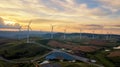 Sunset landscape Wind turbines farm clean green energy for elect